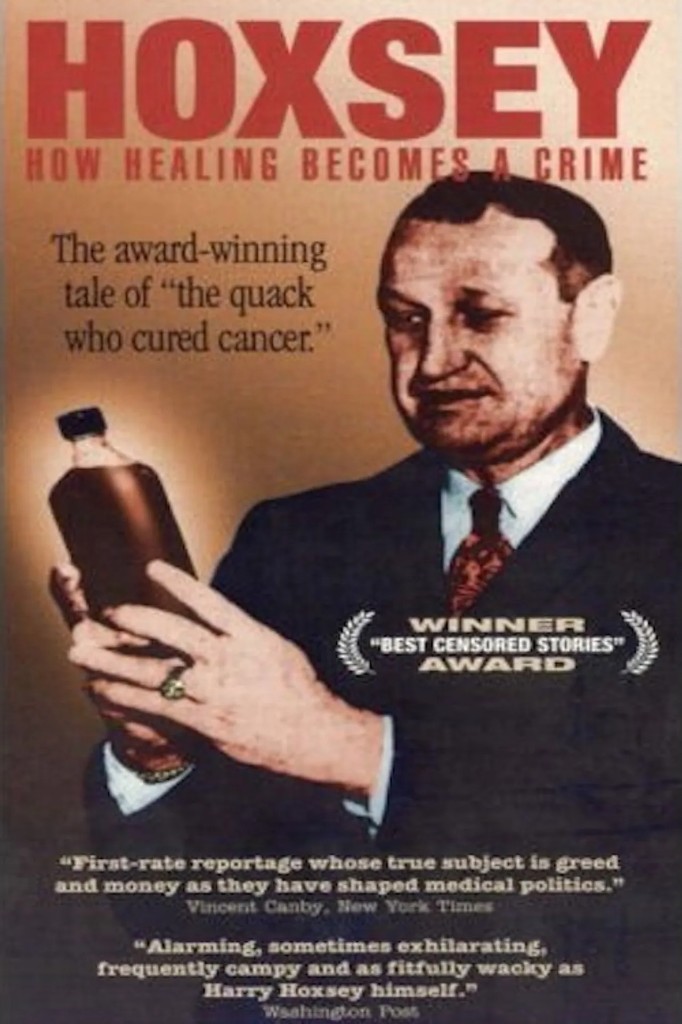 Harry Hoxsey holding a bottle of his herbal tonic